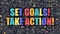 Set Goals Take Action on Dark Brick Wall.