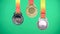 A set of gold silver and bronze award medals over a green background