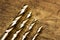 Set of golden drill bits on wooden background