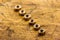 Set of golden nuts on wooden background