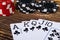 Set of good black cards on a wooden table, for playing for money