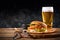 Set of hamburger beer and french fries. A standard set of drinks and food in the pub, beer and snacks. Dark background