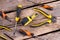 Set of hand construction tools on wooden background.