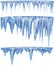 Set of hanging thawing icicles of a blue shade