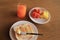 Set of healthy breakfast, plate of toast with butter and fresh fruits and orange juice