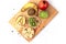 A set of healthy three rice cake meal with slice of banana, kiwi, apple, multiple seeds and fresh whole fruits on wooden board
