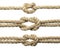 Set of hemp ropes with knots on white background, closeup