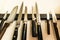 Set of high quality kitchen cook knives tools on a magnet board hanging on the wall