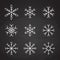 Set of icy snowflakes chalked sketch symbol