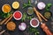 Set of Indian fragrant spices and herbs on a black stone background. Turmeric, dill, paprika, cinnamon, saffron, basil and