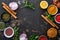 Set of Indian fragrant spices and herbs on a black stone background. Turmeric, dill, paprika, cinnamon, saffron, basil and