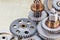 Set of industrial cogwheels for machinery on brass background