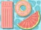 A set of inflatable swimming mattresses. Inflatable donut, mattress in the shape of a watermelon.