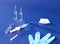 Set for injections - syringe, ampoules, and an alcohol wipe on a blue background