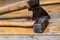 Set of iron tools ax hammer close-up old wooden handle weathered on boards