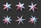 Set of isolated metallic stars on dark grey background