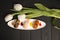 Set of Japanese Nigiri Sake Sushi with salmon, tiger shrimp and eel with white tulips on background. Top view