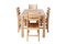 A set of kitchen furniture made of natural wood, a dining table and four chairs, isolated on the white background