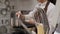 A set of kitchen tools in a professional kitchen, a cook in the background.