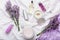 Set lavender skincare cosmetics products. Natural spa beauty products fresh lavender flowers on fabric. Lavender essential oil