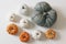 Set of little white orange and big green pumpkins isolated on table background. Assortment of various gourd vegetable