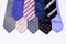 Set of luxury men\'s classic ties of different shapes and colors  red blue violet  isolated on a white background