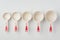 Set of Measuring Cups Lined on White Background Top View
