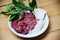 Set of meat beef slice liver and mushroom vegetables on white plate for cooked or Sukiyaki Shabu shabu Japanese foods