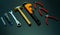 Set of mechanic tools on black background. Chrome wrenches or spanners, hexagon socket, end cutter pliers, locking pliers, pincers