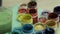 Set of multi colors gouache on plastic jars. Rotation multicolor background. A lot of varicolored paint gouache jars