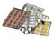 Set of multicolor pills in white blister packs