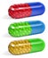 Set of multicolored half transparent oblong capsules filled with