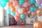 Set of multicolored metallic glossy balloons with strings in modern interior. Room decoration. For birthdays, parties