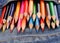 set of multicolored pencils in blue jeans pocket