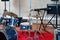 Set of musical instruments ready for rehearsal of music band in modern sound studio