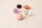 A set of natural stones lies on a light white background  garnet  amethyst  carnelian  rock crystal and rose quartz. Collection of