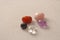 A set of natural stones lies on a light white background  garnet  amethyst  carnelian  rock crystal and rose quartz. Collection of