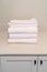 Set of neatly folded clean white ribbed towels