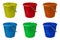 Set of new, classic, plastic buckets. Green, yellow, blue, red, orange and light blue bucket isolated on a white background