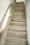 Set of newly built bare wood poplar stairs during home remodel, unpainted, unfinished