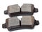 Set of old asbestos brake pads on a white background in a photography studio. Spare part of a car for replacement in a car service