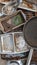 A set of old baking trays dishes and pans in a childs outdoor mud kitchen portrait
