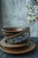 A set of old ceramic tableware. A set of plates, bowls. A branch of apricots. Dark wooden background