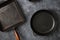 Set old grill pans dark stone background top view