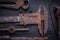 Set of old rusted tools on vintage board