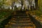 A set of old stone steps lead up to a collection of gravestones