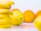 Set of oranges, yellow lemons and slices piled together, close up view. Fruits composition on light background. Juicy