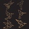 a set of origami bird logos on a black background with different flying models