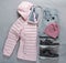 A set of outer sportswear - a pink jacket, trousers and sneakers