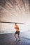 Set the pace then out-run yourself. a young man going for a run against an urban background.